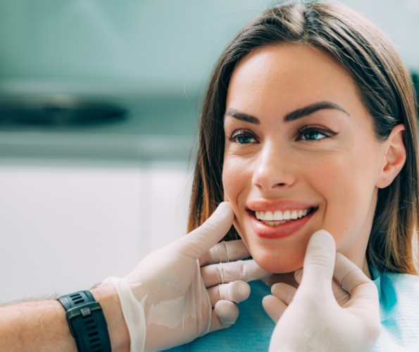 Dentist looking at a smiling patient