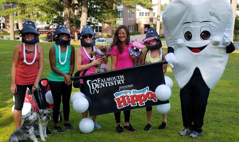 Falmouth Dentistry team members wearing hippo hats at Hungry Hungry Hippos event