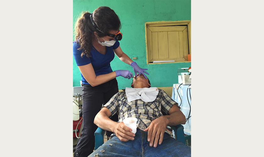 Doctor Chadbourne treating a young male dental patient