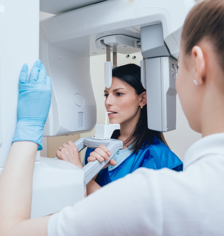 Woman getting scans of her mouth and jaw with advanced dental technology