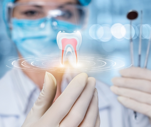 Dentist with hologram of tooth in their hand