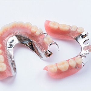 Partial dentures replace multiple teeth along an arch