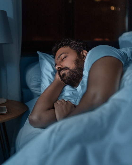 Bearded man sleeping on his side