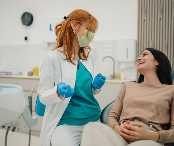 Patient smiling at dentist in treatment chair