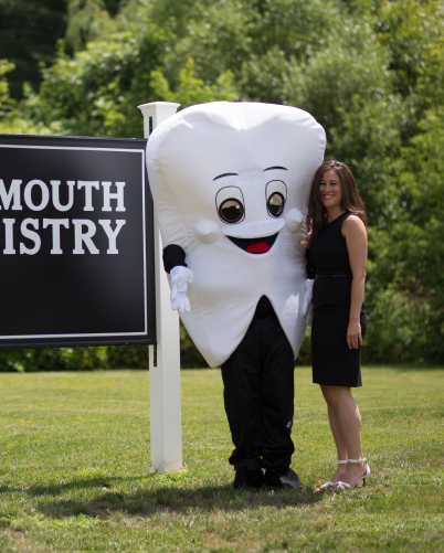 Doctor Falmouth with person in tooth mascot costume outdoors