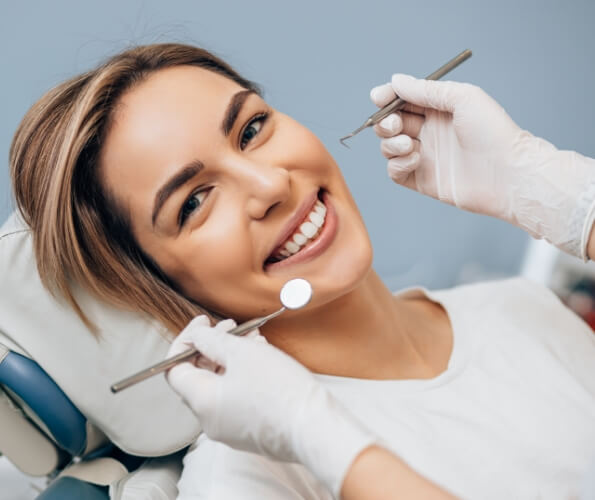 Woman smiling during dental checkup