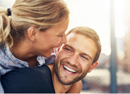 Man giving woman a piggyback ride