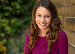 Smiling woman in maroon blouse